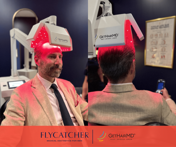 male hair loss patient under red light therapy laser
