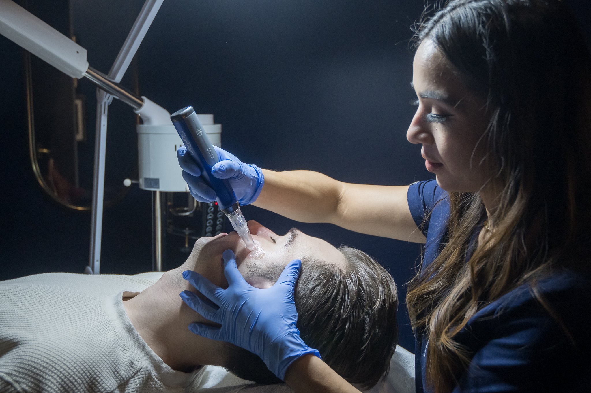 SkinPen microneedling treatment on male client in Austin